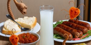 Paraziti koji izlaze iz tradicionalne srpske hrane – vizuelni prikaz skrivenih rizika u ishrani.